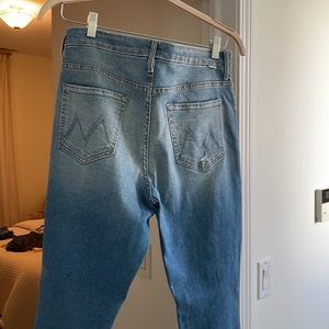 MOTHER skinny jeans size 31. Lighter wash with distressed knees and frayed hem.